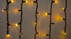 Фото Delux Icicle 75 LED 2x0.7 м черный/желтый flash IP44 EN (90020891)